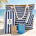 Navy beach bag gift set with blue and white striped beach bag, quick dry towel, ocean blue tumbler, and sea turtle necklace, designed as a beach gift for women and beach lovers.