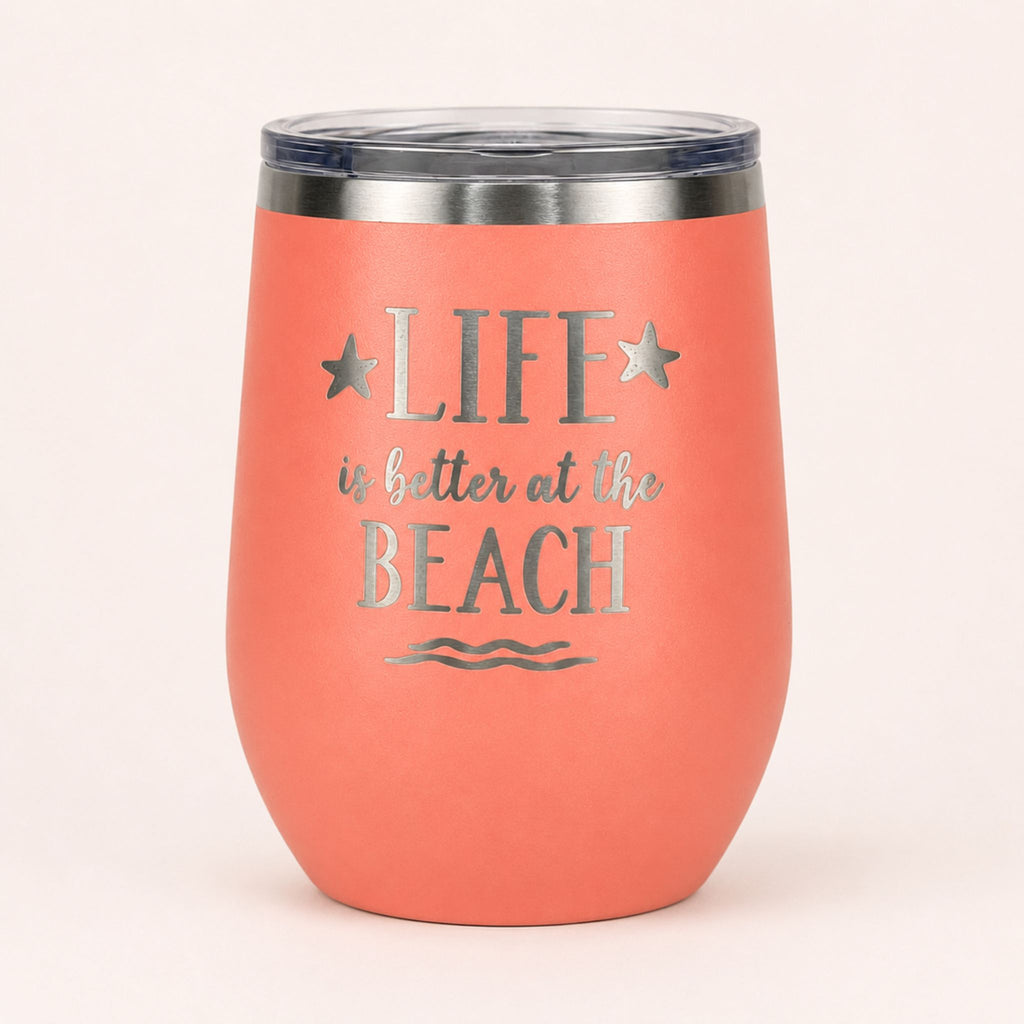 Peach insulated wine tumbler with lid on a clean light background