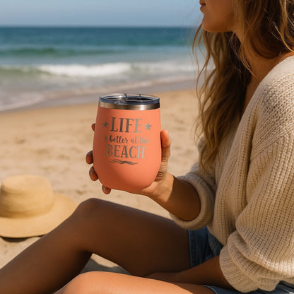 Peach wine tumbler in hand, relaxing by the ocean