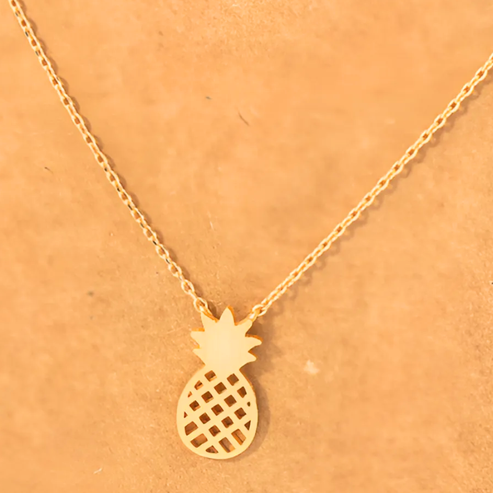 Zoomed-in view of the 18k gold-dipped pineapple cutout pendant necklace, displaying the fine detailing and luxurious gold finish