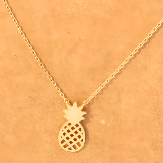 Zoomed-in view of the 18k gold-dipped pineapple cutout pendant necklace, displaying the fine detailing and luxurious gold finish