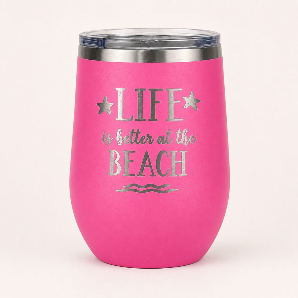 Pink insulated wine tumbler with lid on a clean light background