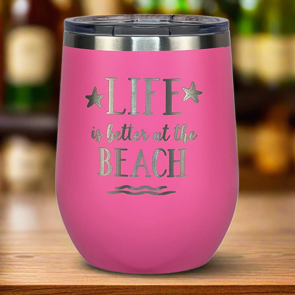 pink, engraved, "Life is better at the beach" metal drink tumbler with lid is perfect for keeping your wine or other drinks the right temperature