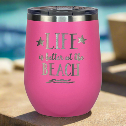 12 oz pink, engraved, "Life is better at the beach" insulated metal drink tumbler with lid is perfect for keeping drinks cold by the pool