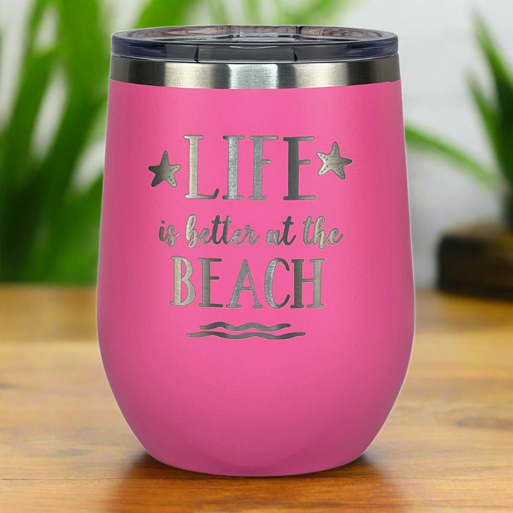 12 oz pink, engraved, "Life is better at the beach" insulated metal drink tumbler with lid is perfect for keeping drinks hot or cold