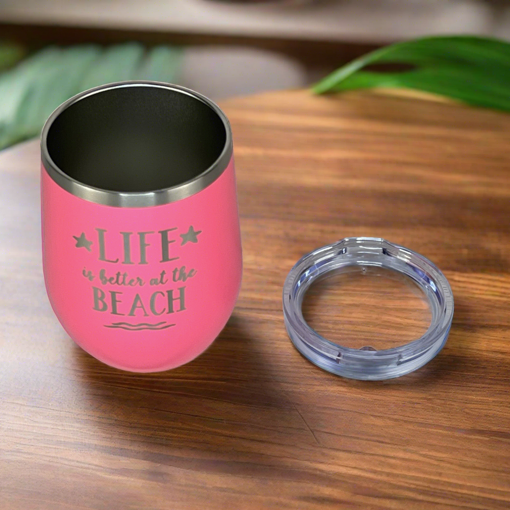 12 oz pink, engraved, "Life is better at the beach" insulated metal drink tumbler with lid is perfect for keeping drinks hot or cold