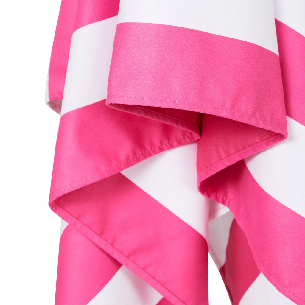 Close-up of pink striped microfiber beach towel fabric and edge detail
