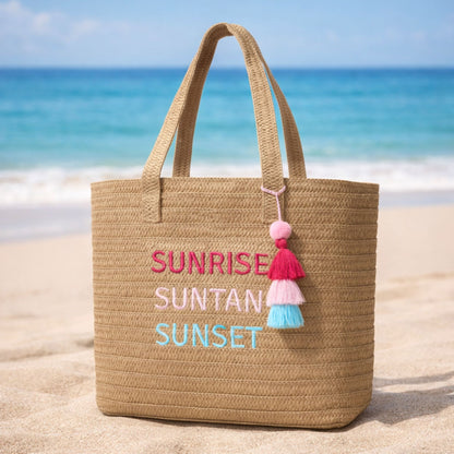 Raffia Message Beach Bag Tote: Sunrise, Suntan, Sunset with Tassel on the beach