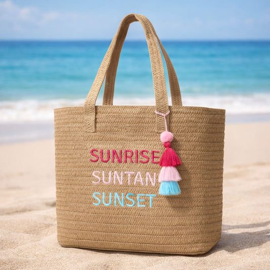 Raffia Message Beach Bag Tote: Sunrise, Suntan, Sunset with Tassel on the beach