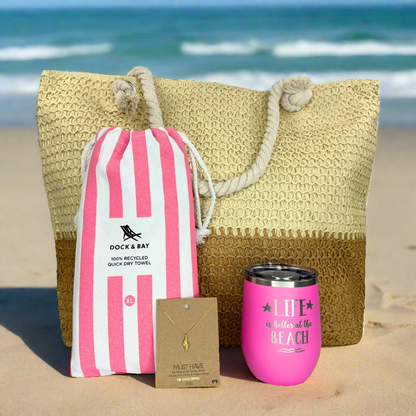 Seaside Beach Lover Gift Set including a tan beach tote, 18k gold conch shell necklace, banana bliss towel, and pink wine tumbler for beach enthusiasts