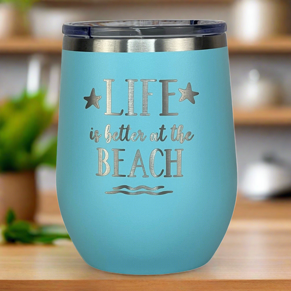 teal, engraved, "Life is better at the beach" metal insulated drink tumbler with lid keeps drinks hot or cold