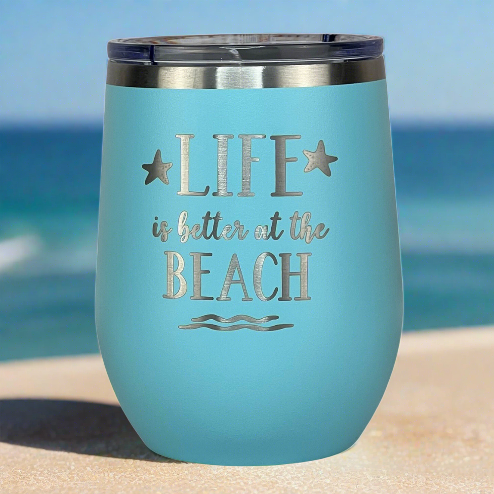 Close-up of teal tumbler lid and engraved design
