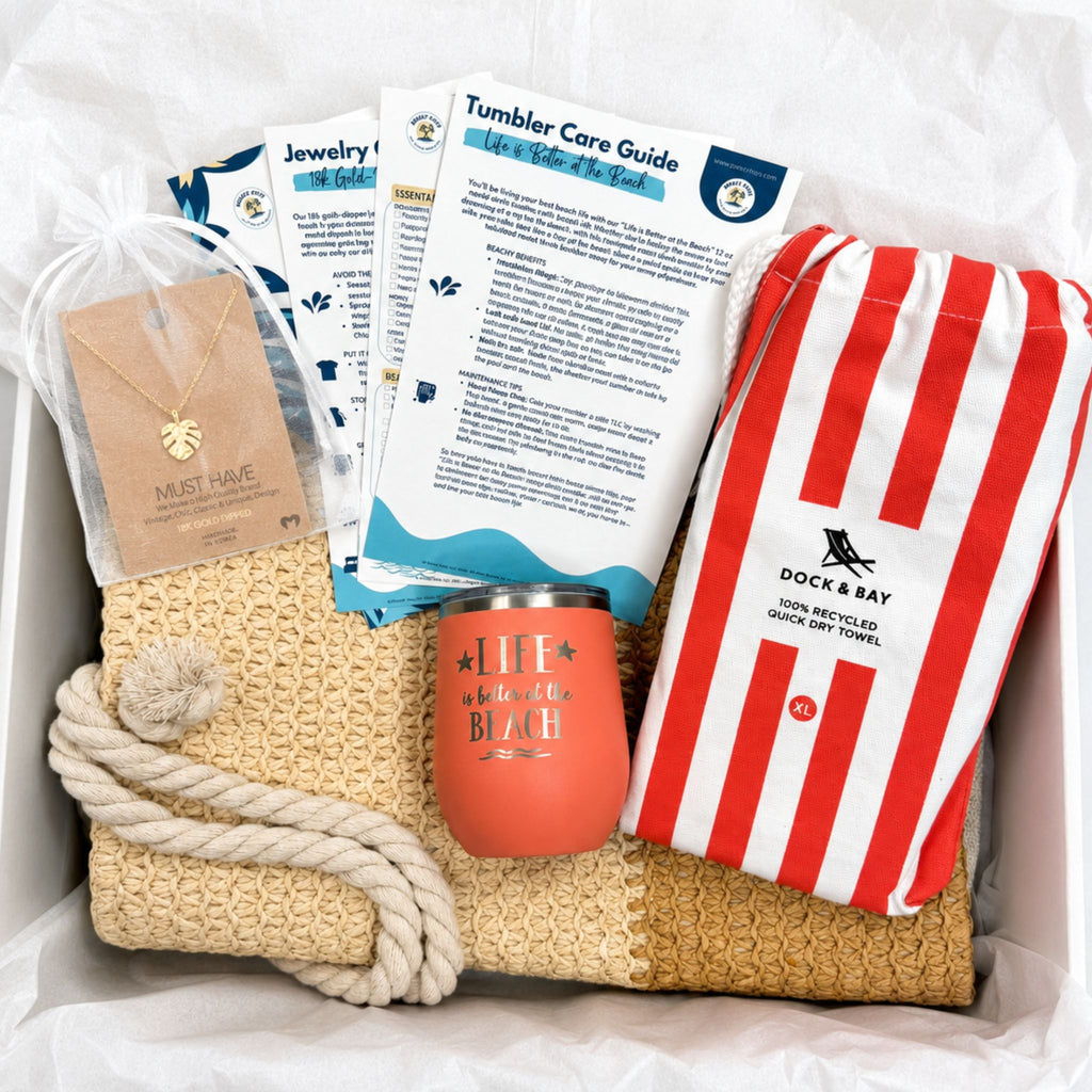 Unique gift for beach lovers with coral beach bag, striped towel, peach tumbler, gold-dipped necklace and gift-ready packaging.