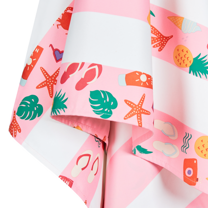 close up of pink striped beach pattern, quick dry, sand free kids beach towel with palm trees, starfish, pineapples and other beach themed items