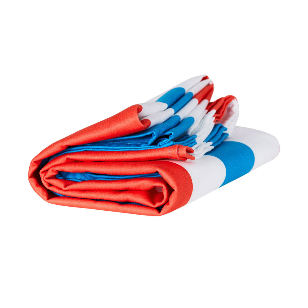 compactly folded red, white and blue quick dry and sand free beach towel