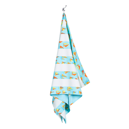 light blue striped with sailboat pattern, quick dry, sand-free kids beach towel hanging on hook