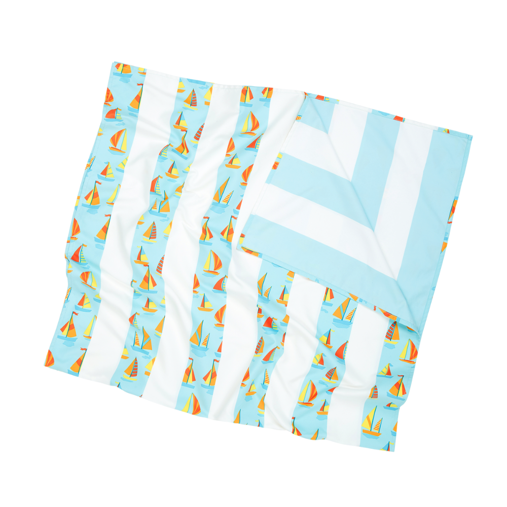 light blue striped with sailboat pattern, quick dry, sand-free kids beach towel showing light blue and white striped pattern on reverse side